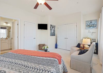 Main bedroom with ceiling fan and private bathroom
